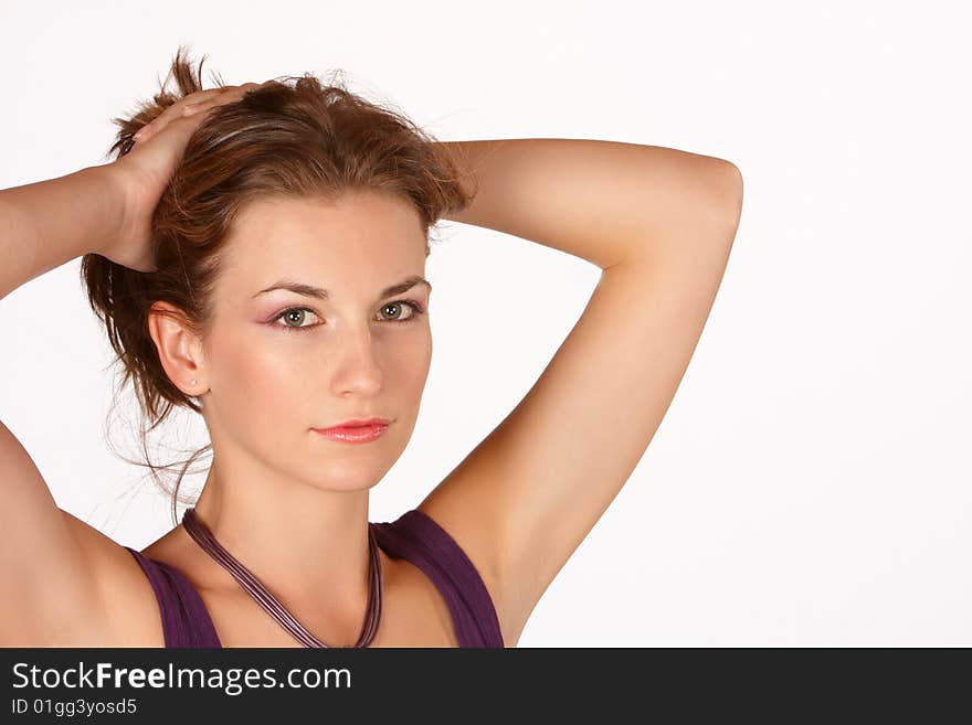 Brunette with hand holding hair above the head. Brunette with hand holding hair above the head