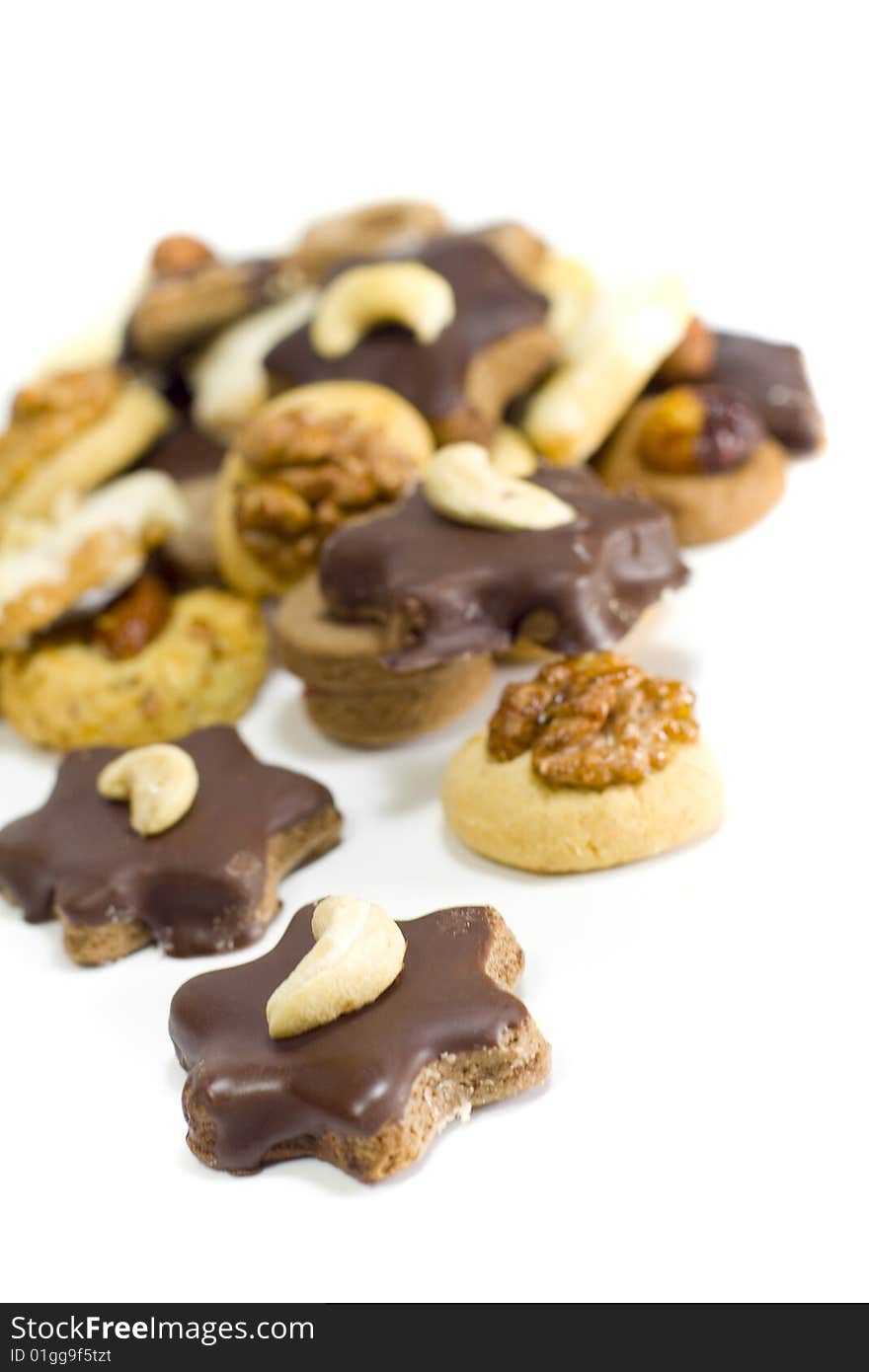 Cookies with chocolate and nuts closeup on white background