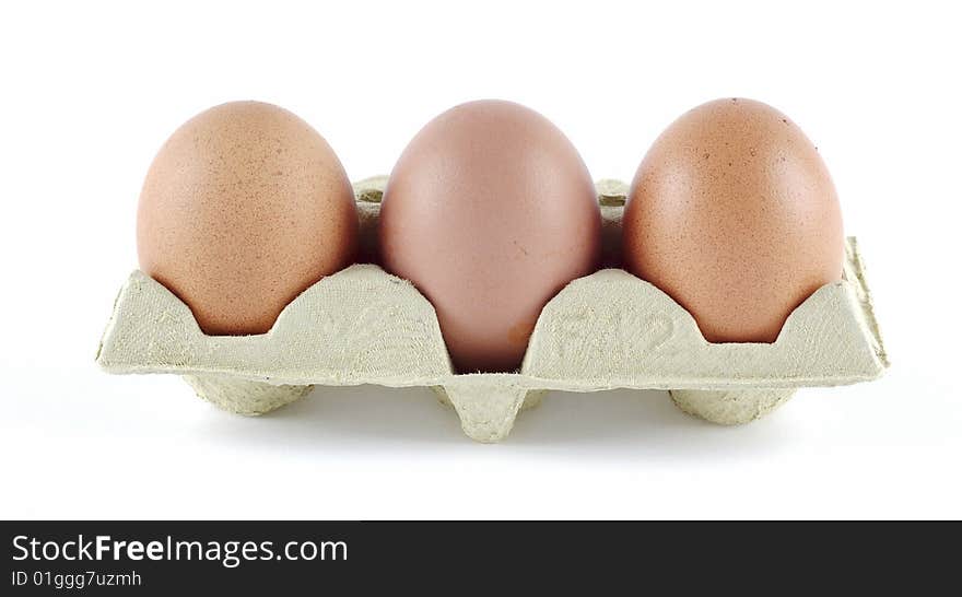 Strip of three eggs on egg cartons