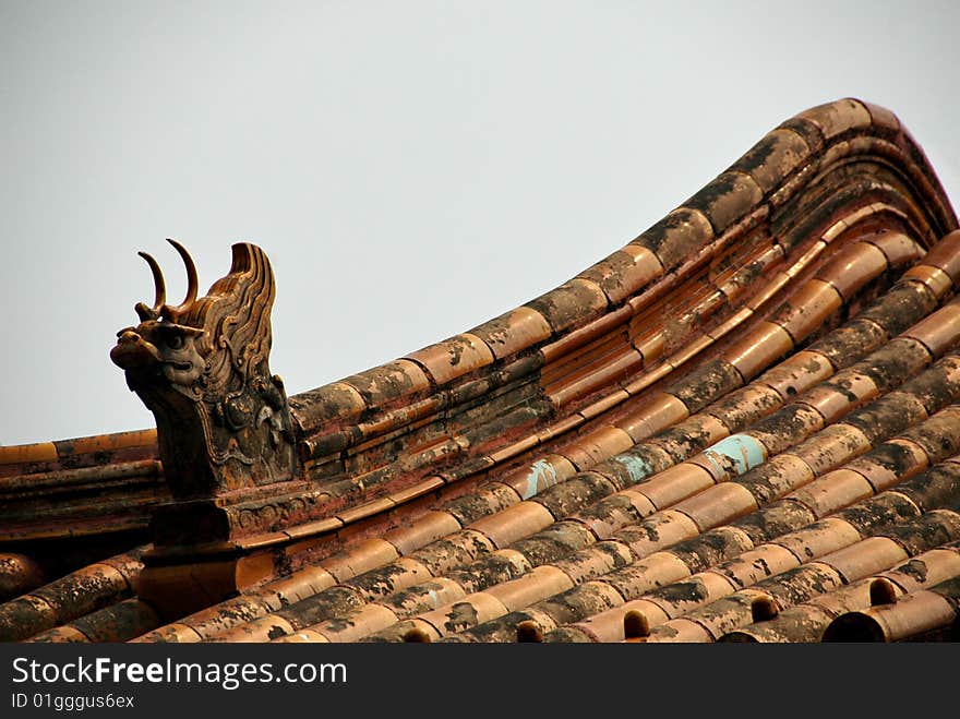 Roof top of a chinese temple with dragon and tiles. Roof top of a chinese temple with dragon and tiles