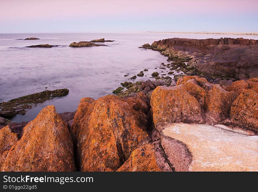 Beautiful ocean cove taken in Anna Bay, NSW, Australia during twilight conditions.