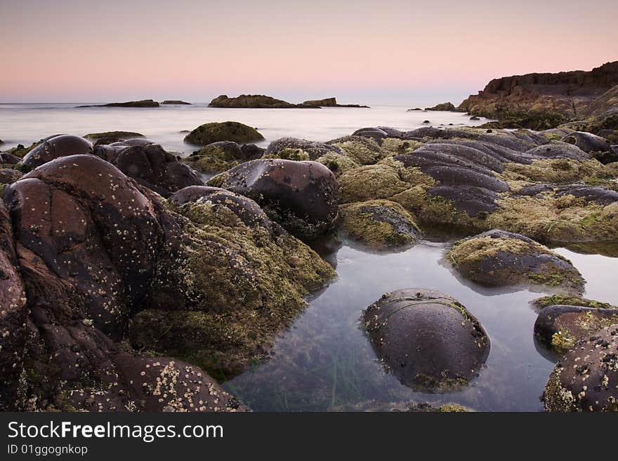 Beautiful ocean cove taken in Anna Bay, NSW, Australia during twilight conditions.