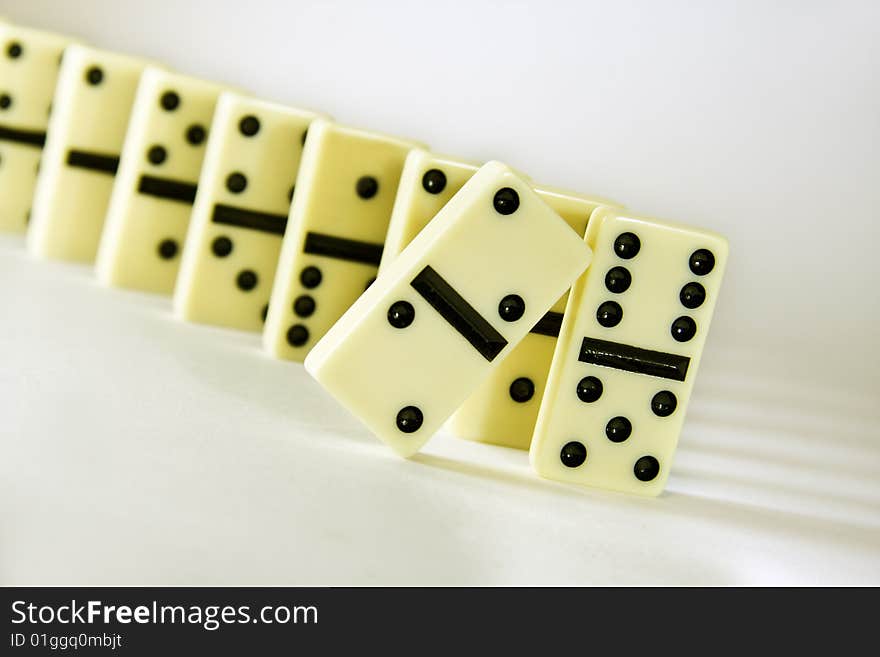 Dominoes diagonal white background, concept