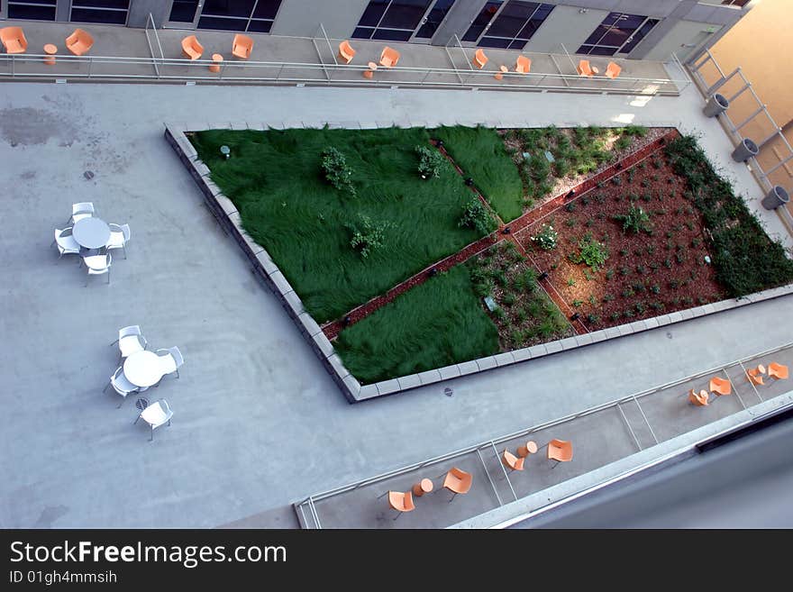 A modern loft courtyard with tables and chairs