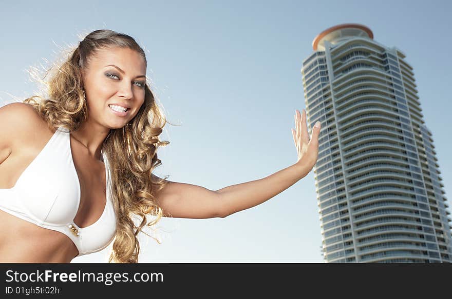 Woman holding a building