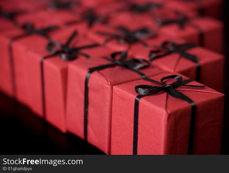 Many red gift boxes on black background