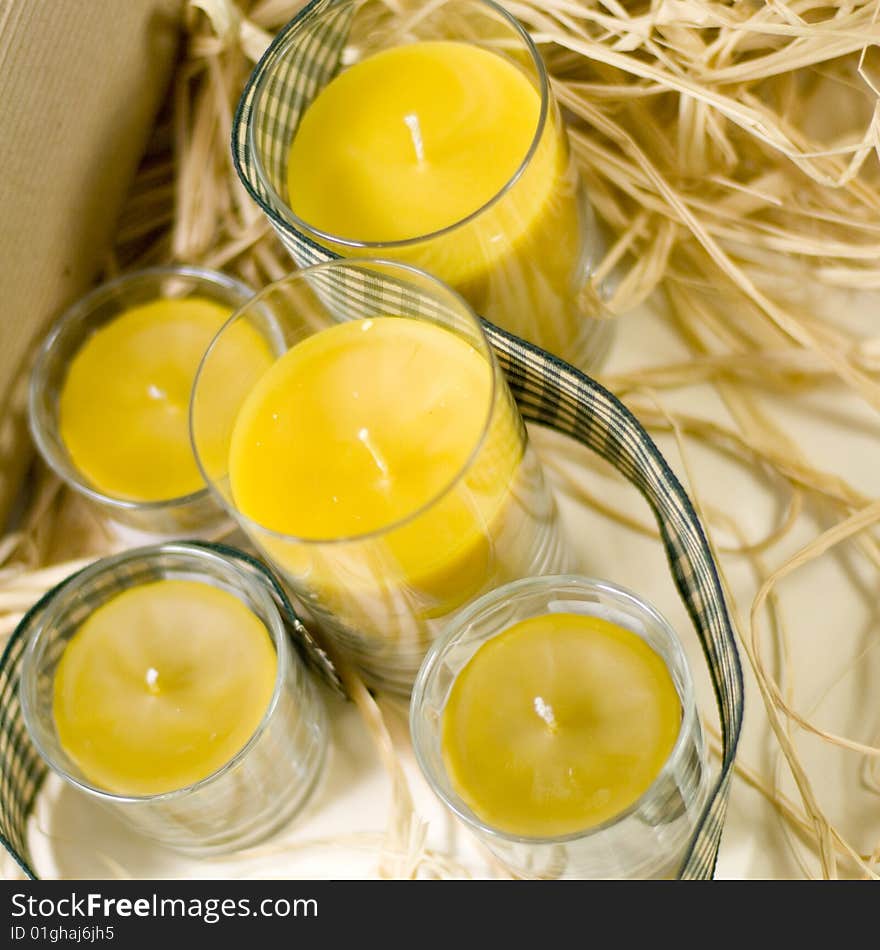 Yellow candles, ribbon and box closeup