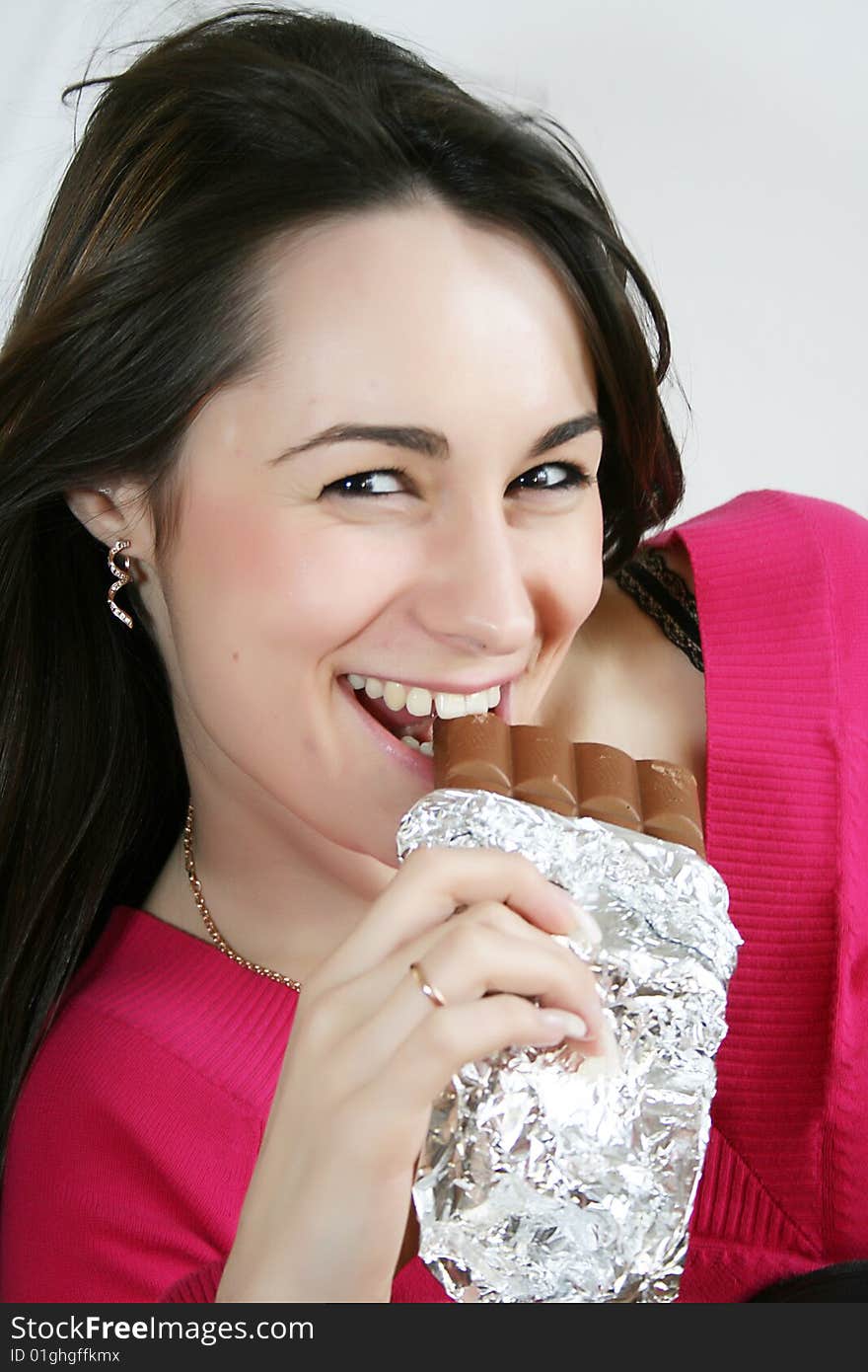 Woman Eating A Chocolate