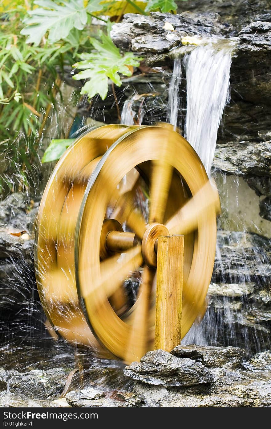 A turning water wheel in the park