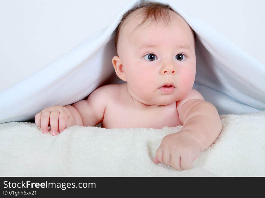 Little baby under towel