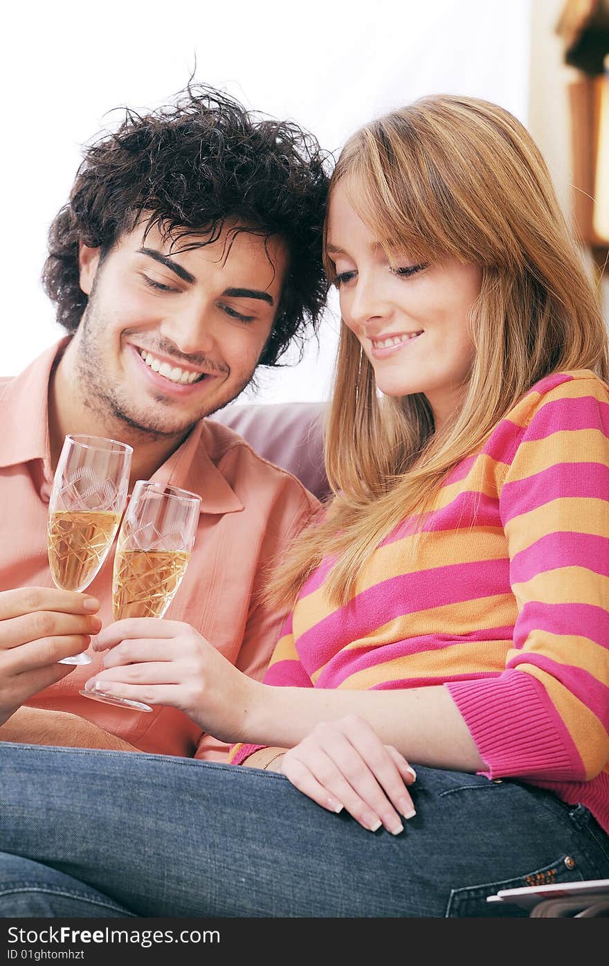 Young couple smiling and drinking together. Young couple smiling and drinking together