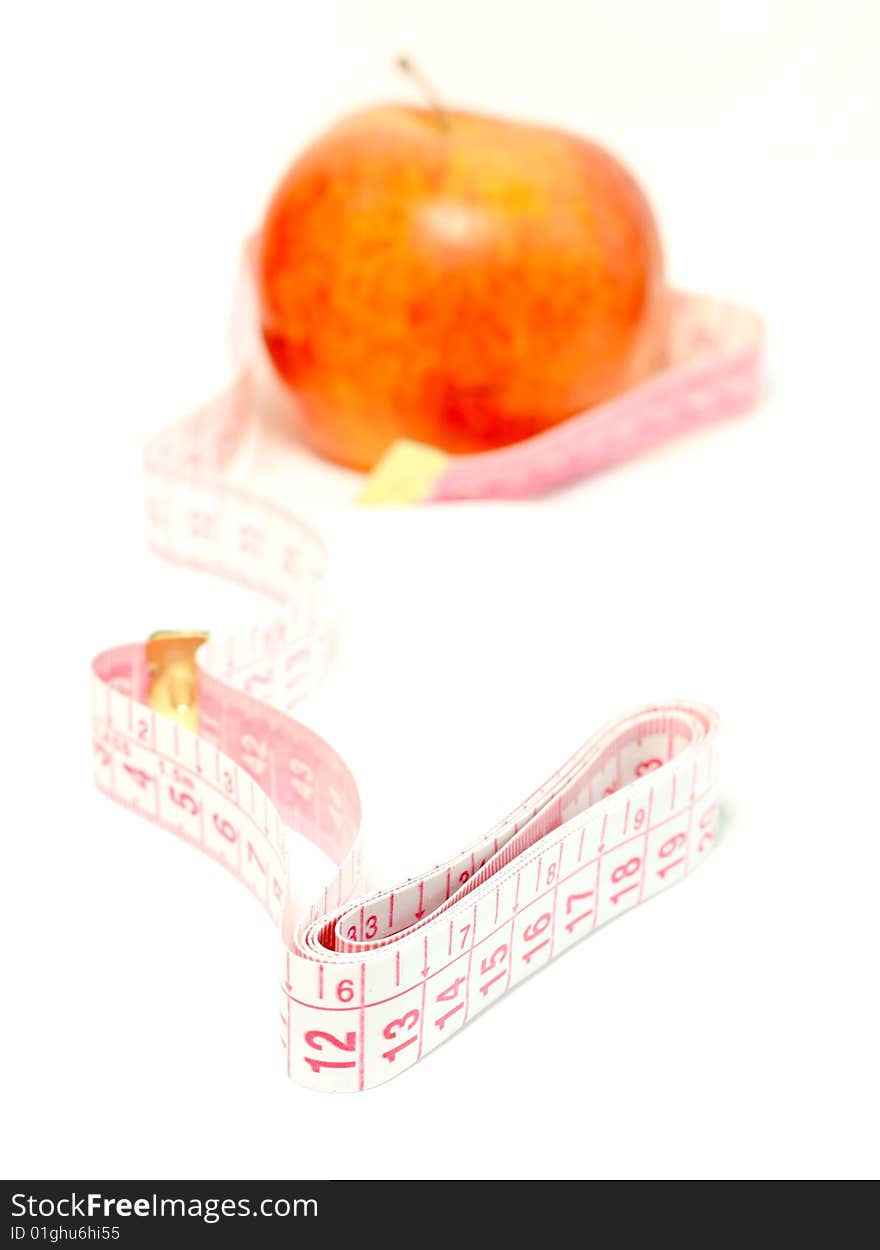 Diet, apple and measuring tape isolated on white background