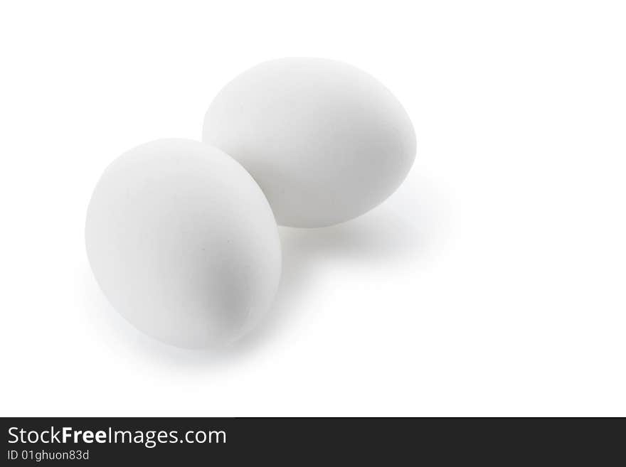 Two white eggs isolated on white background