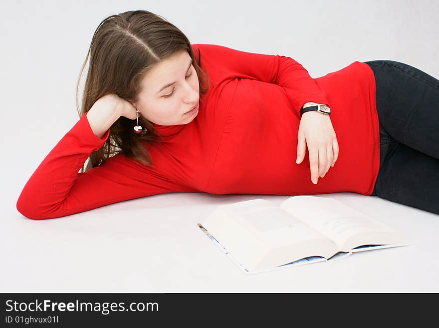 Young beautifful girl who read a book in isloated white background