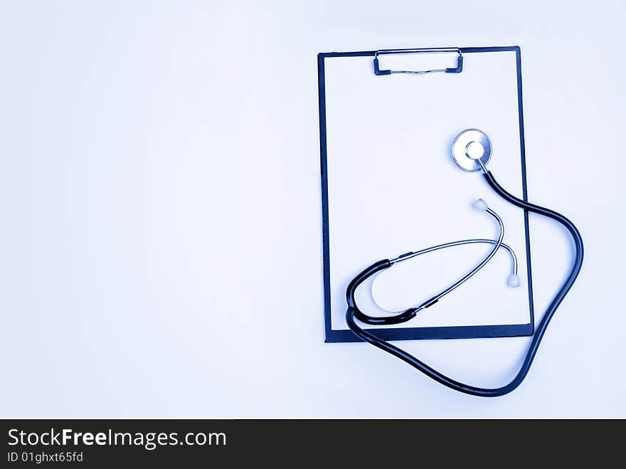 Medical clipboard and stethoscope isolated on white background