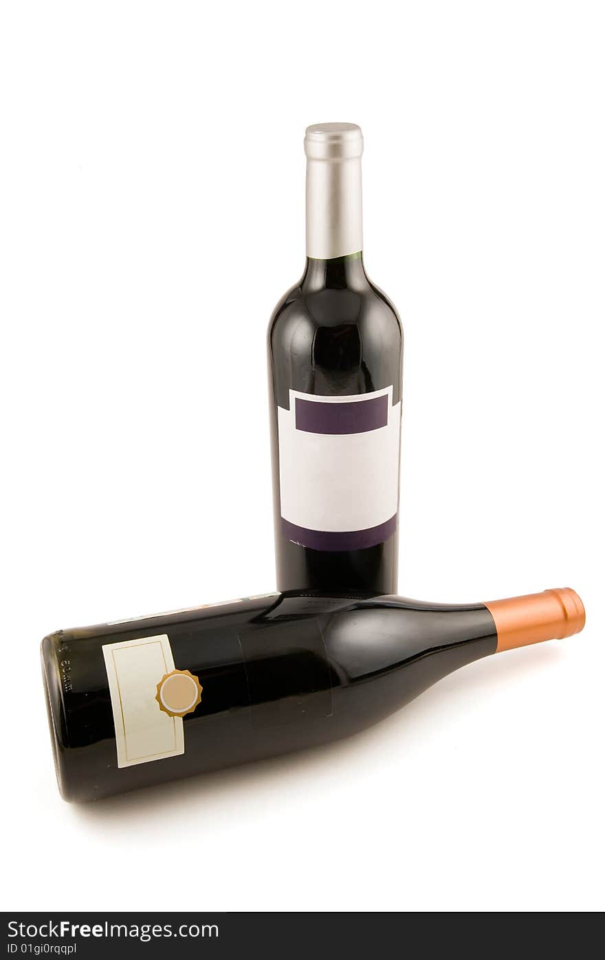 Two bottles of red wine on a white background. Two bottles of red wine on a white background