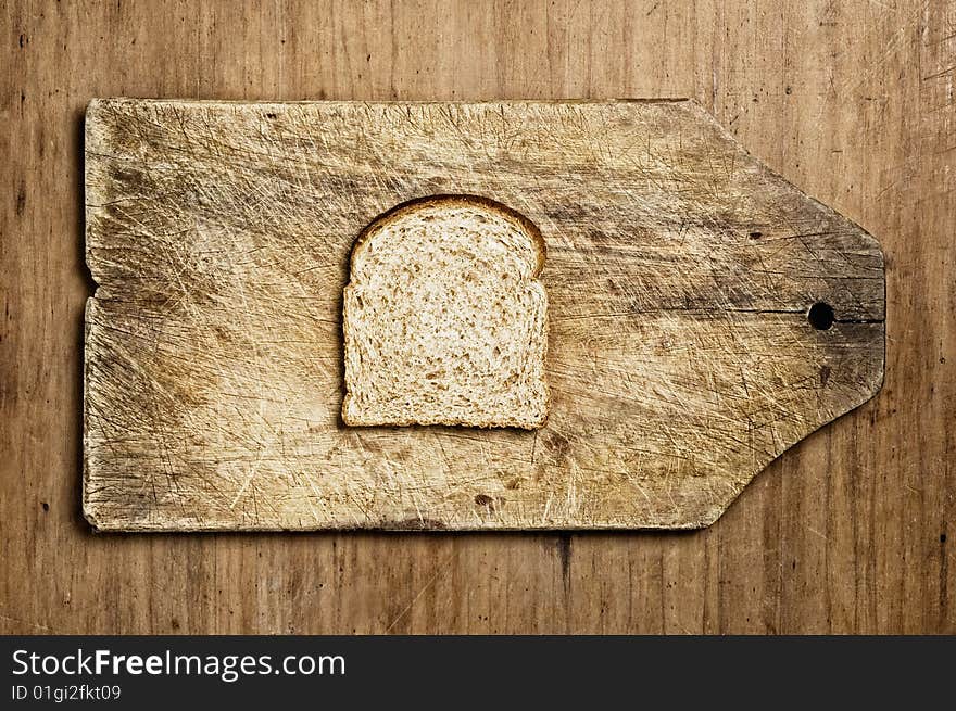 Slice of wholemeal bread on a table. Slice of wholemeal bread on a table.