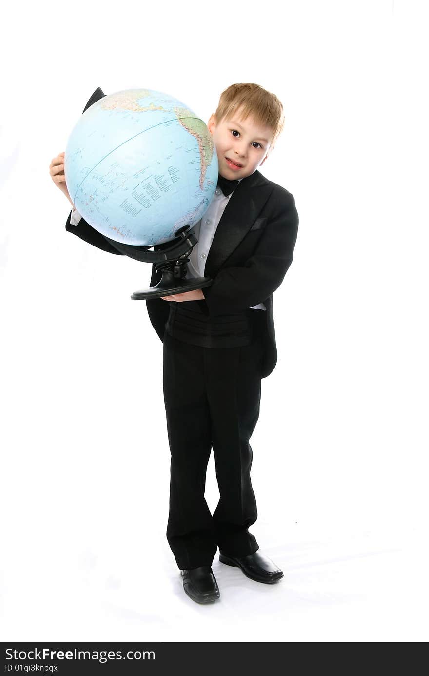 Portrait of a little schoolboy with a globe against white background