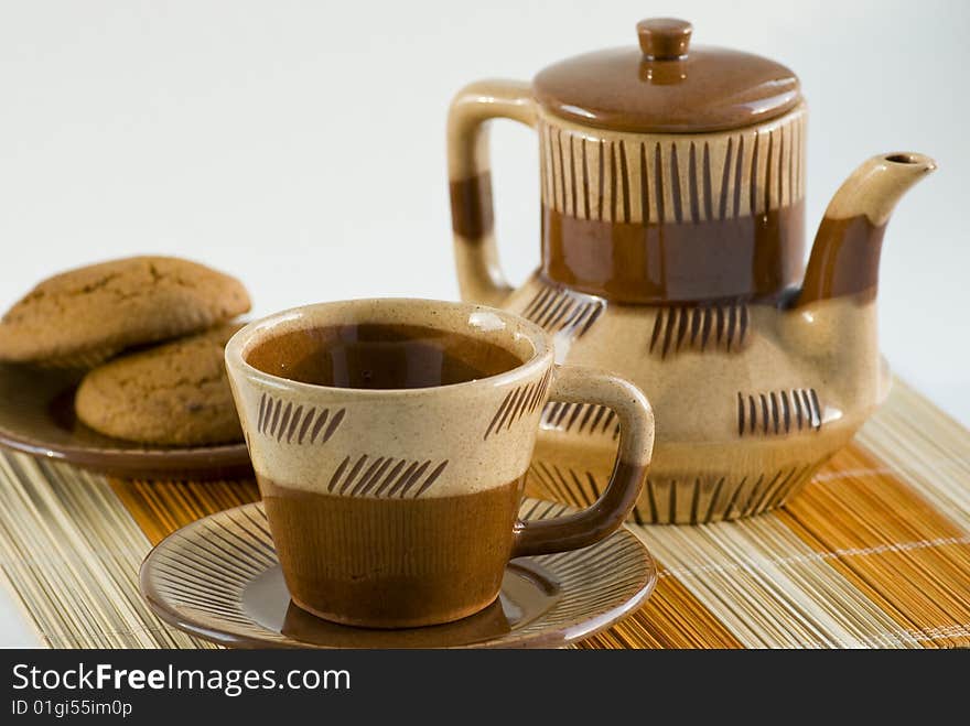 Coffee-pot, cup and biscuit on the table. Coffee-pot, cup and biscuit on the table