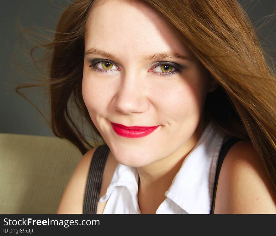 Beautiful woman with flying long red hair