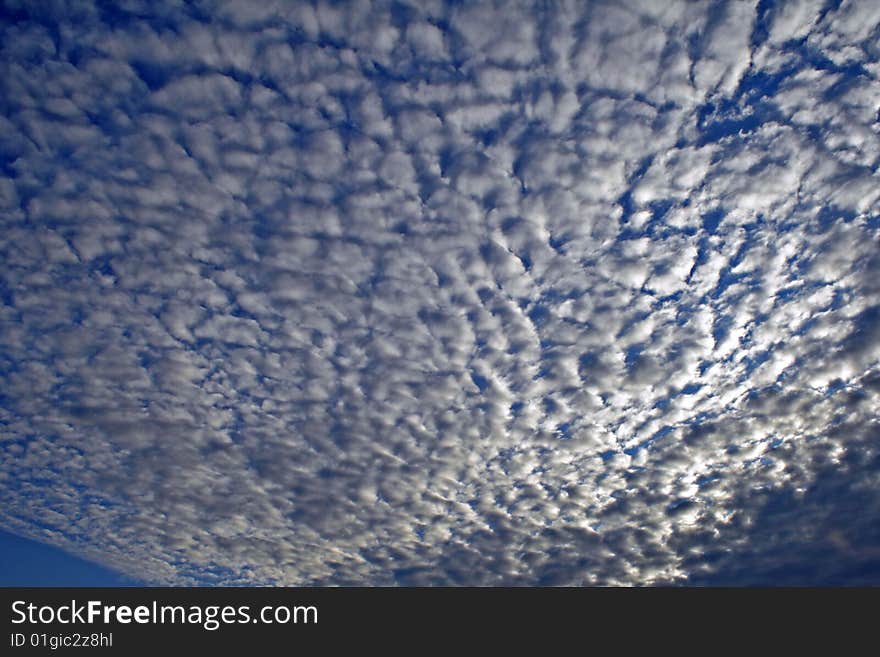 Many white clouds in the blue sky at the summer morning. Many white clouds in the blue sky at the summer morning