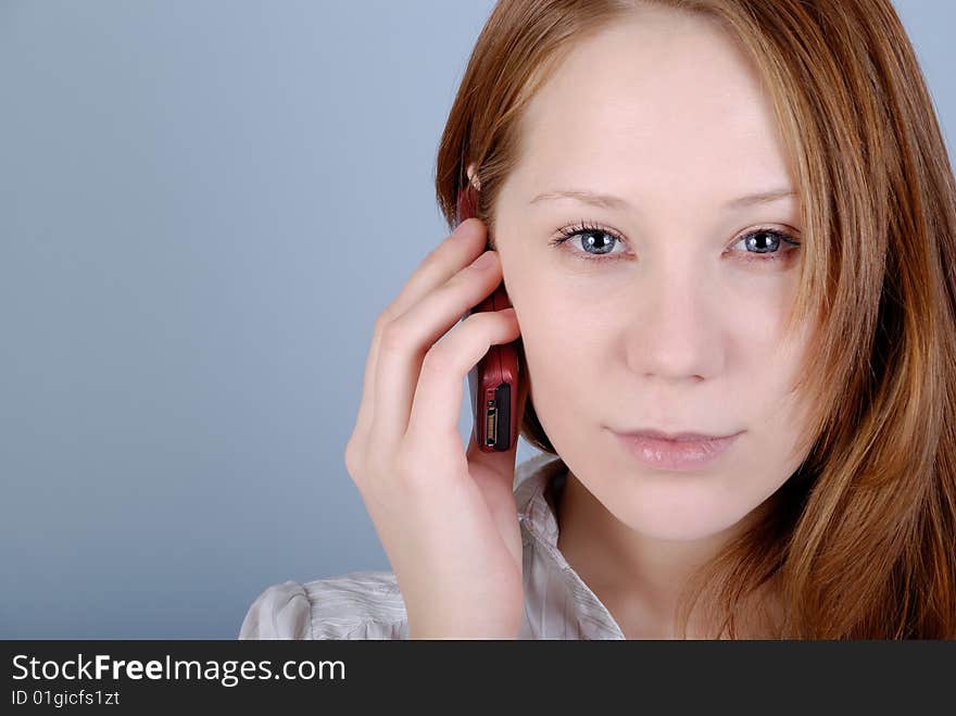 The young woman speaks on the phone