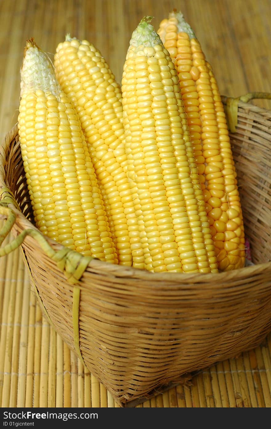 Peeled corns in bamboo basket. Peeled corns in bamboo basket