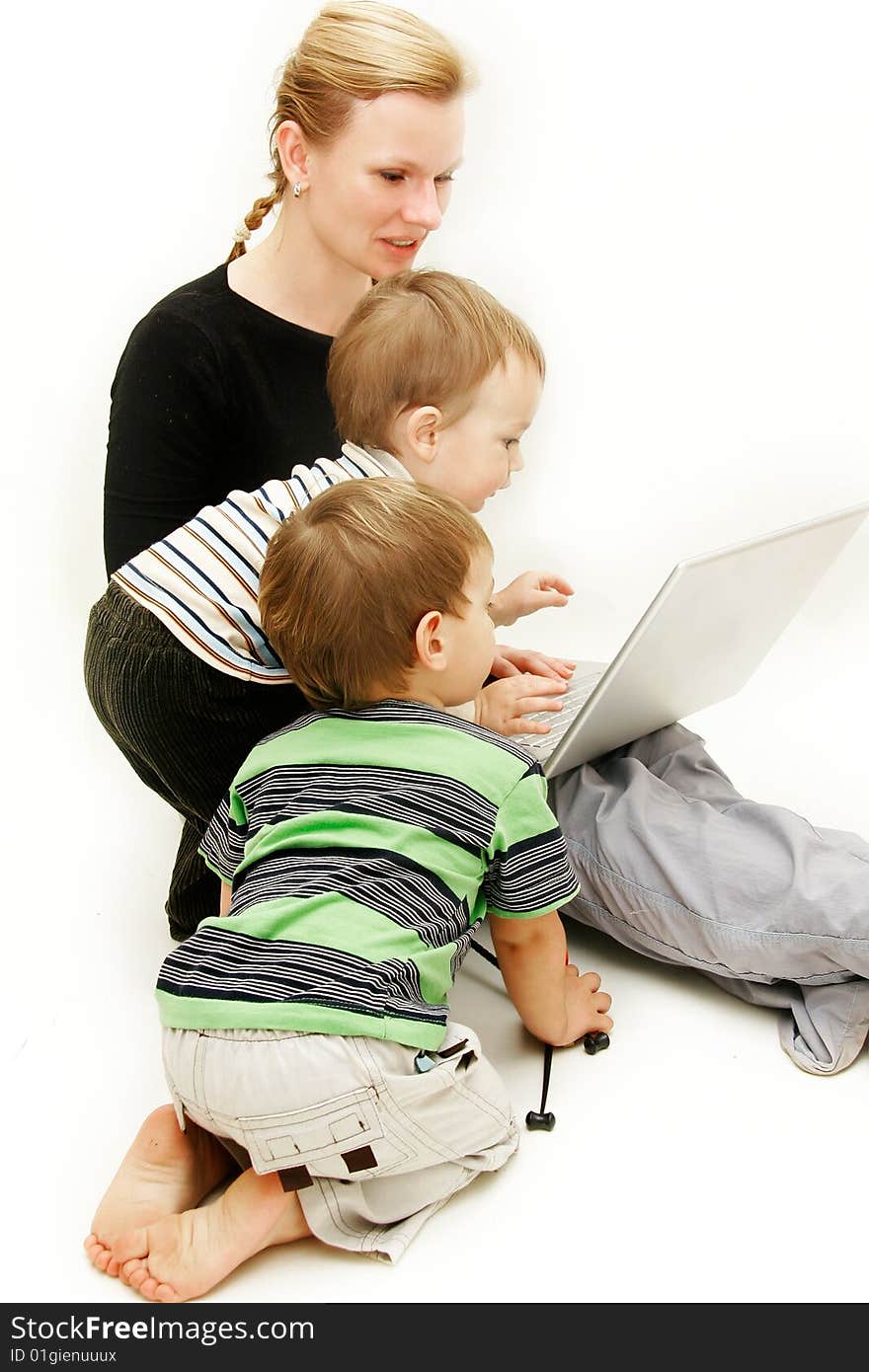 Mother with 2 children and laptop over white