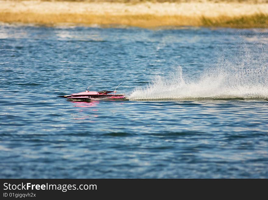 A R/C model hydroplane running over 100 MPH on the race course. A R/C model hydroplane running over 100 MPH on the race course