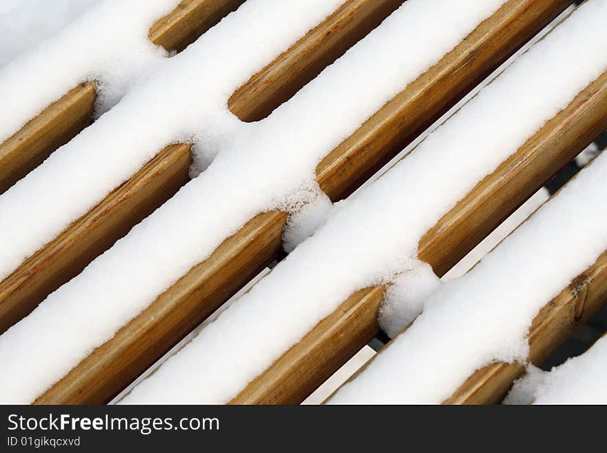 Close-up of the bench covered that it snows. Close-up of the bench covered that it snows.