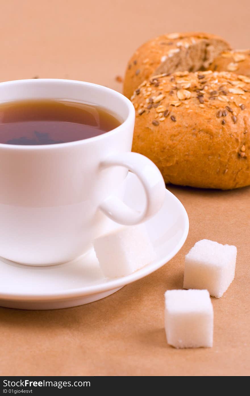 Cup of tea, sugar and bread