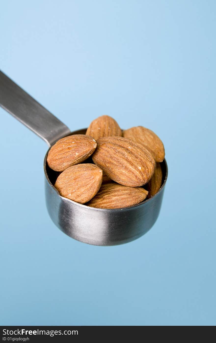 Almonds with blue background