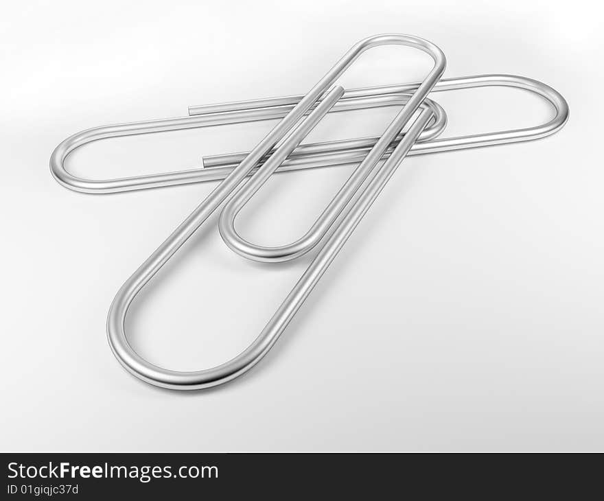 Paper clips on white plane