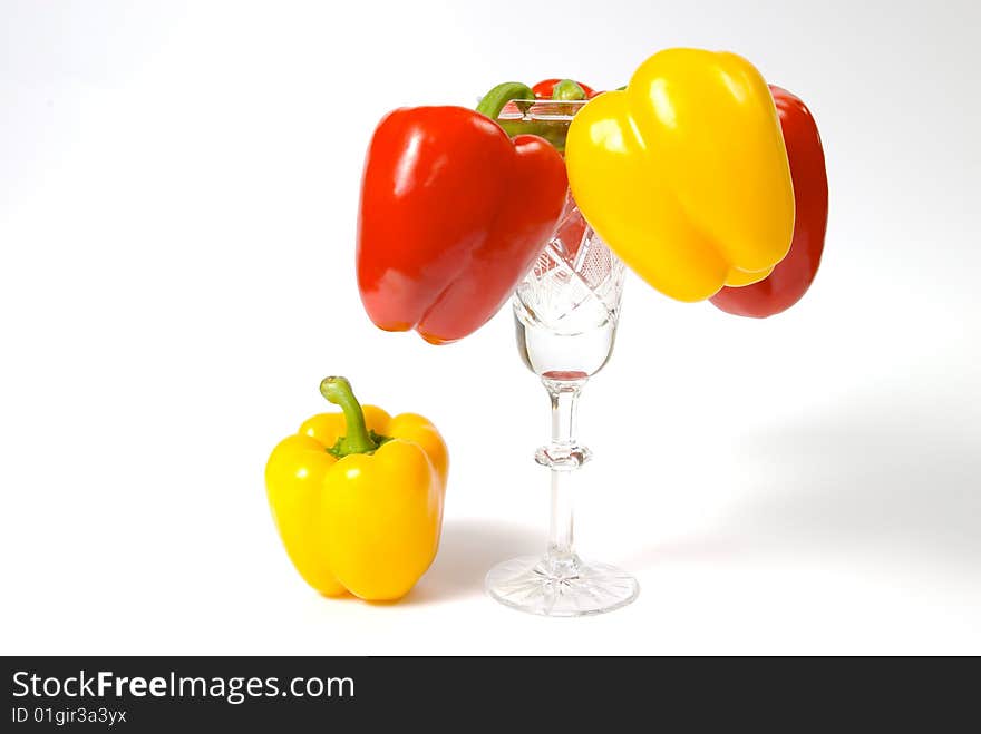 Yellow and red peppers in goblet; fifth unnecessary; place under sun