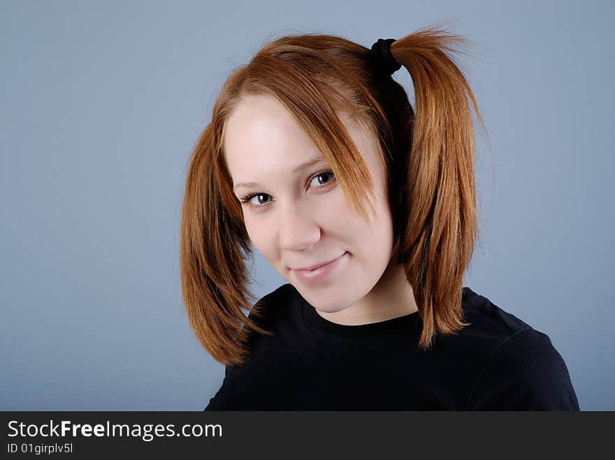 Portrait of a young beautiful woman with pigtail