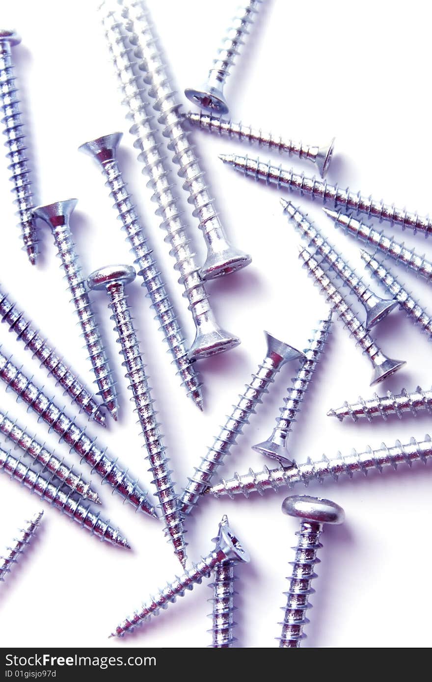 Metal screws closeup on white background