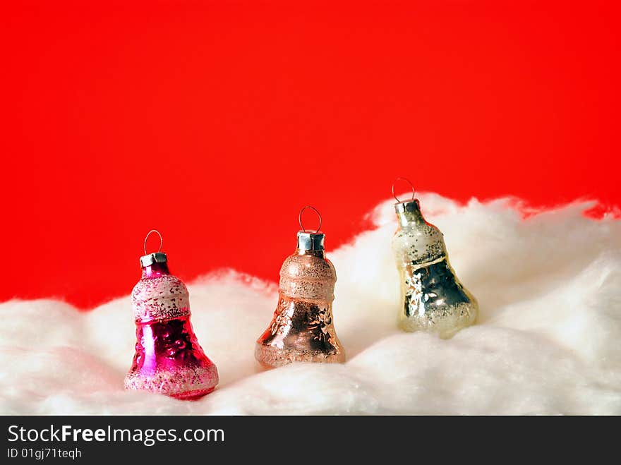 Fur-tree baskets in snow on a red background. Fur-tree baskets in snow on a red background