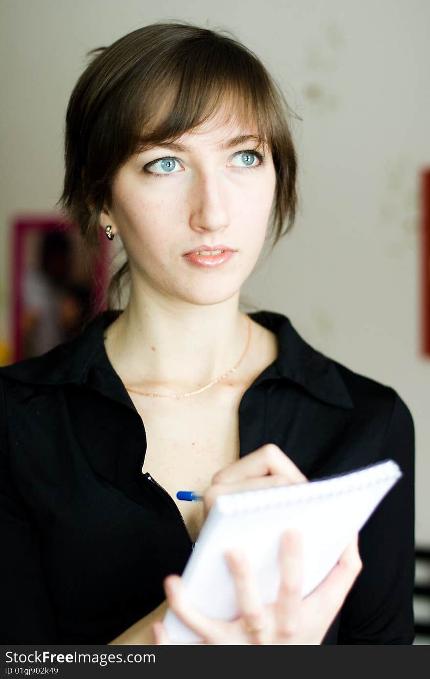 Girl a black jacket with notebook. Girl a black jacket with notebook