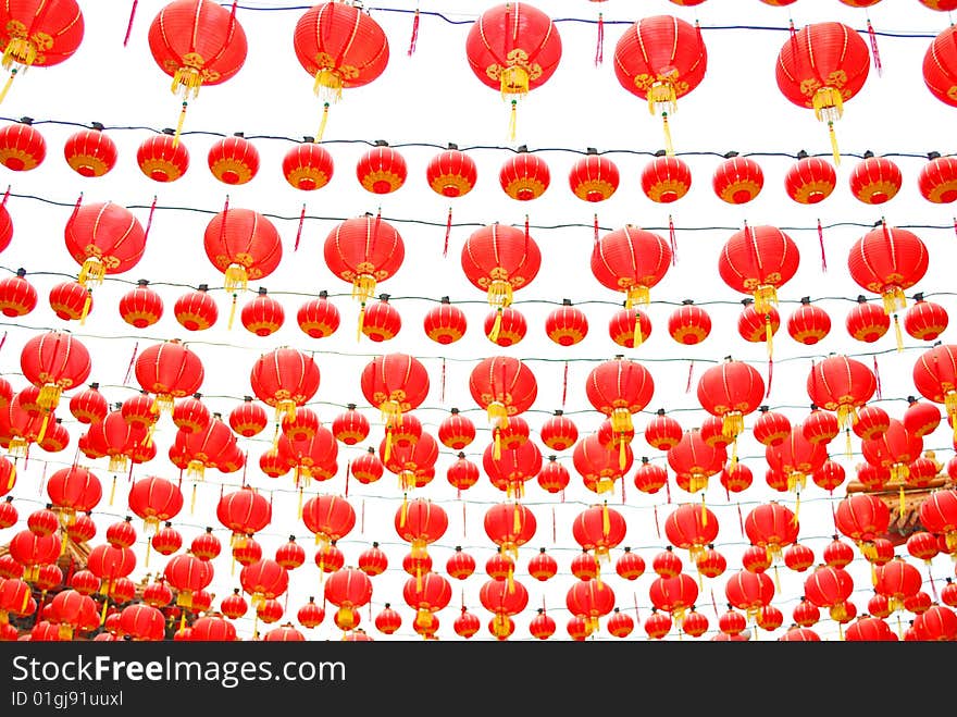 Red chinese lanterns hanging around the chinese temple.