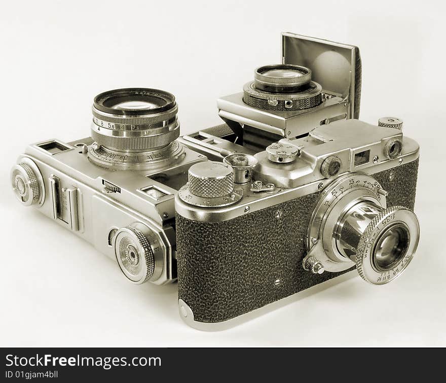 Three antiquarian 35-mm film cameras with put-forward lens. Three antiquarian 35-mm film cameras with put-forward lens.