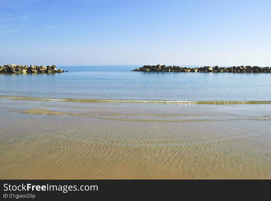 Beach with a stone wall, Adriatic sea, Italy