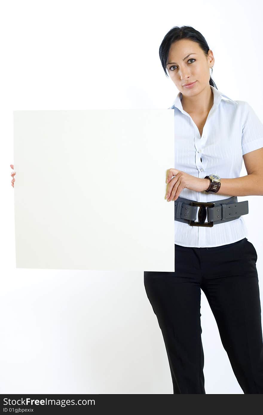 Attractive businesswoman holding a blank board