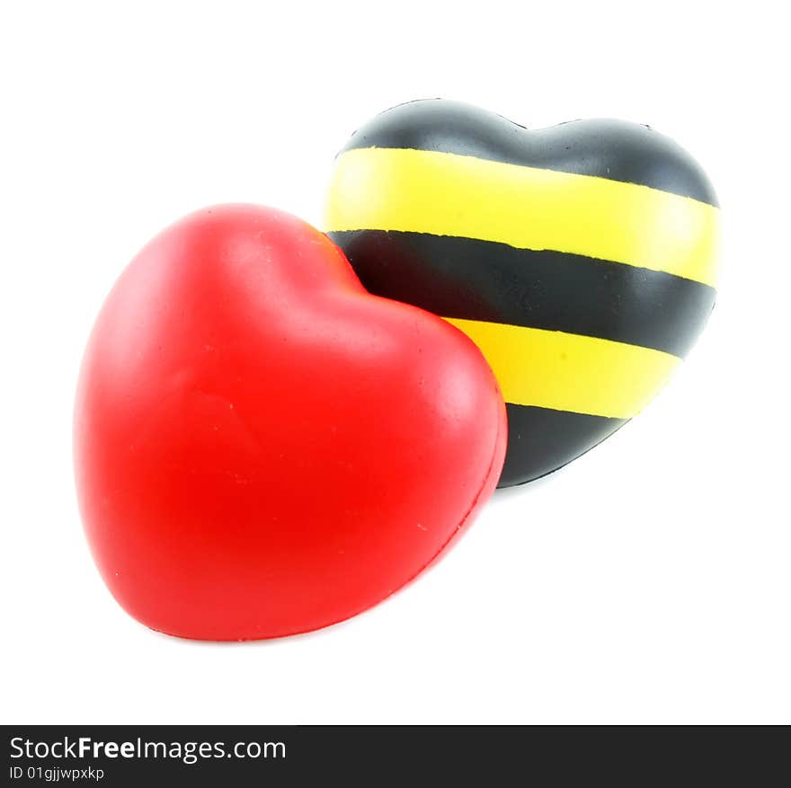 Two soft heart shaped toys isolated on a white background. Two soft heart shaped toys isolated on a white background