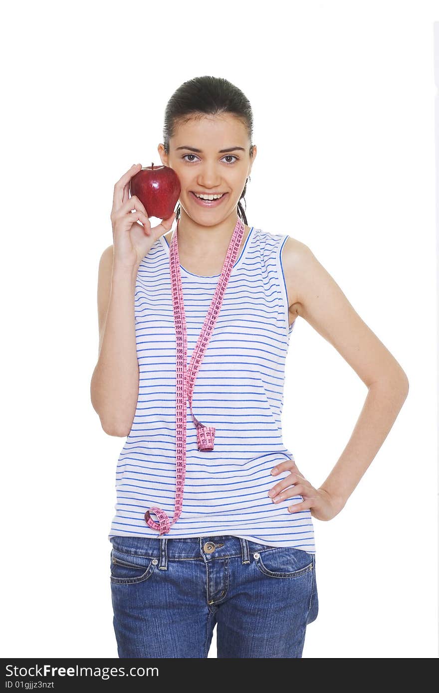 Portrait of cute young woman holding red apple and measuring tape. Portrait of cute young woman holding red apple and measuring tape