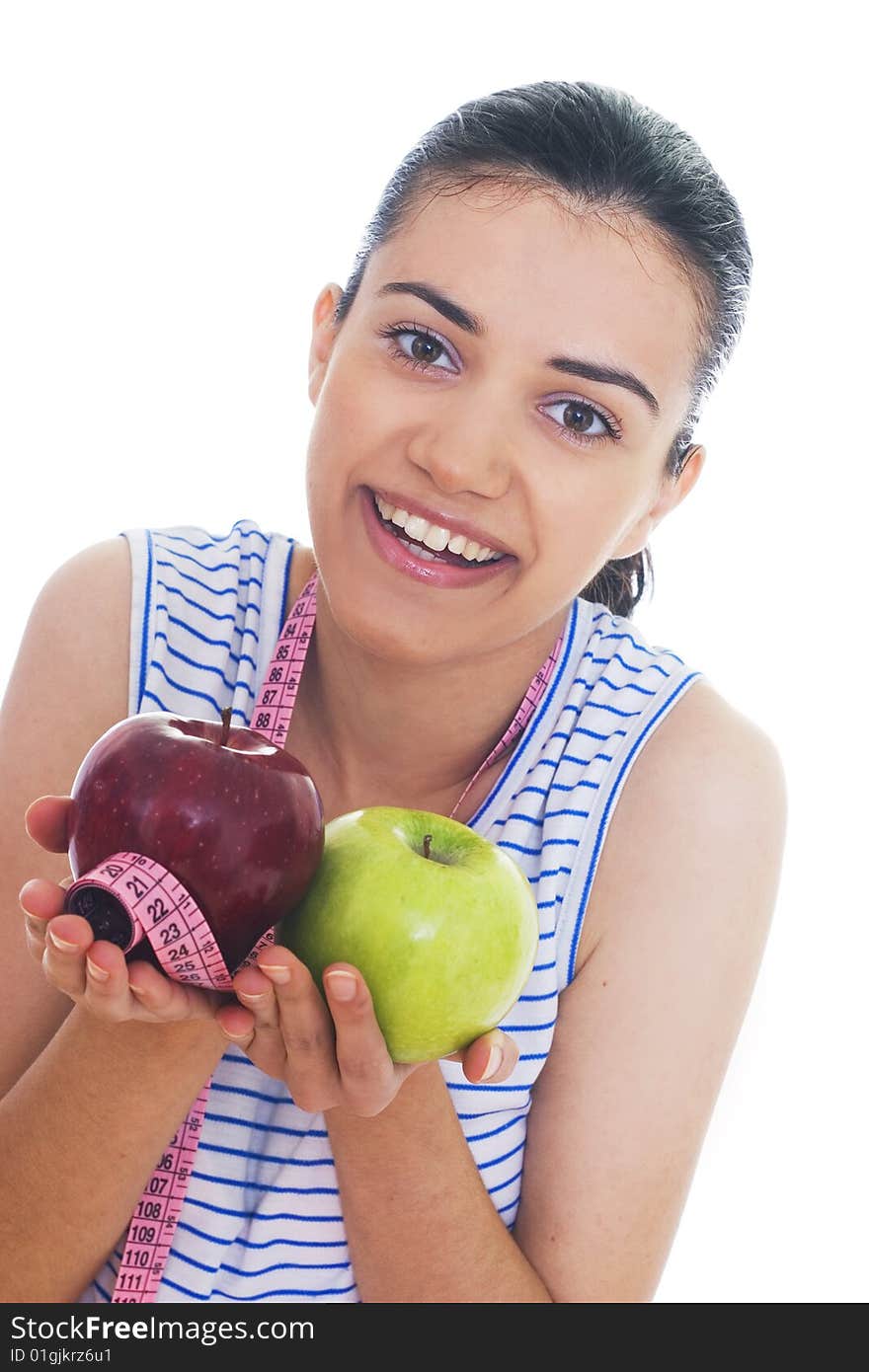 Portrait of cute young woman holding two apples and measuring tape. Portrait of cute young woman holding two apples and measuring tape