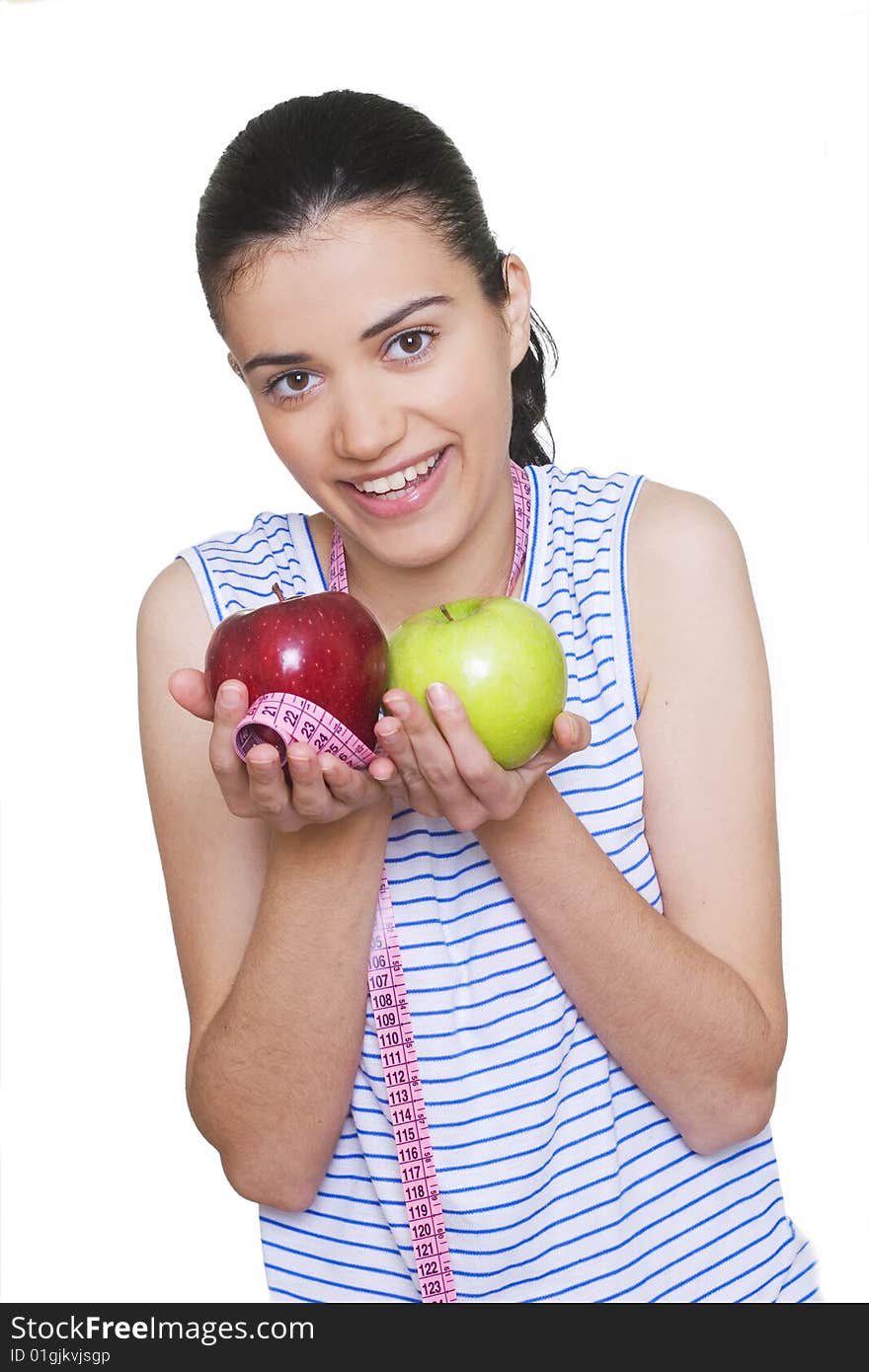 Portrait of cute young woman holding two apples and measuring tape. Portrait of cute young woman holding two apples and measuring tape