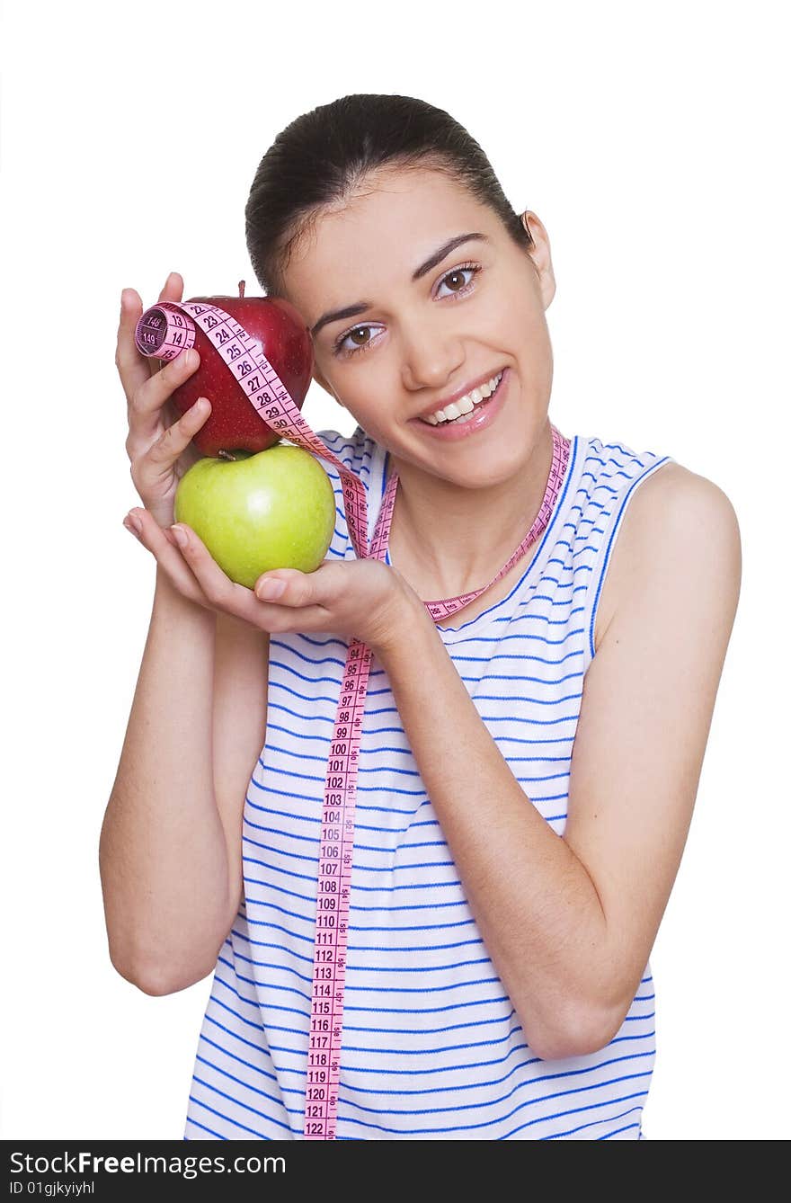 Portrait of cute young woman holding two apples and measuring tape. Portrait of cute young woman holding two apples and measuring tape