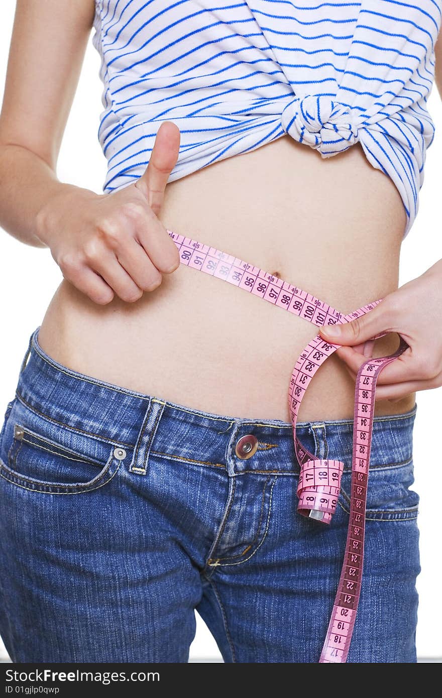 Woman measuring her small waist. Woman measuring her small waist