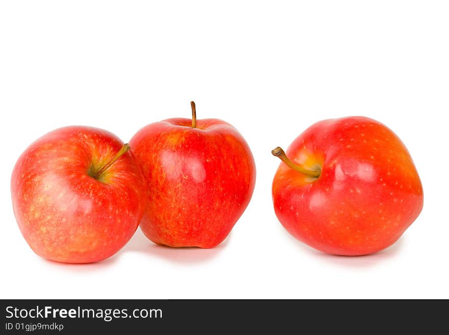 Three red apples isolated on white background