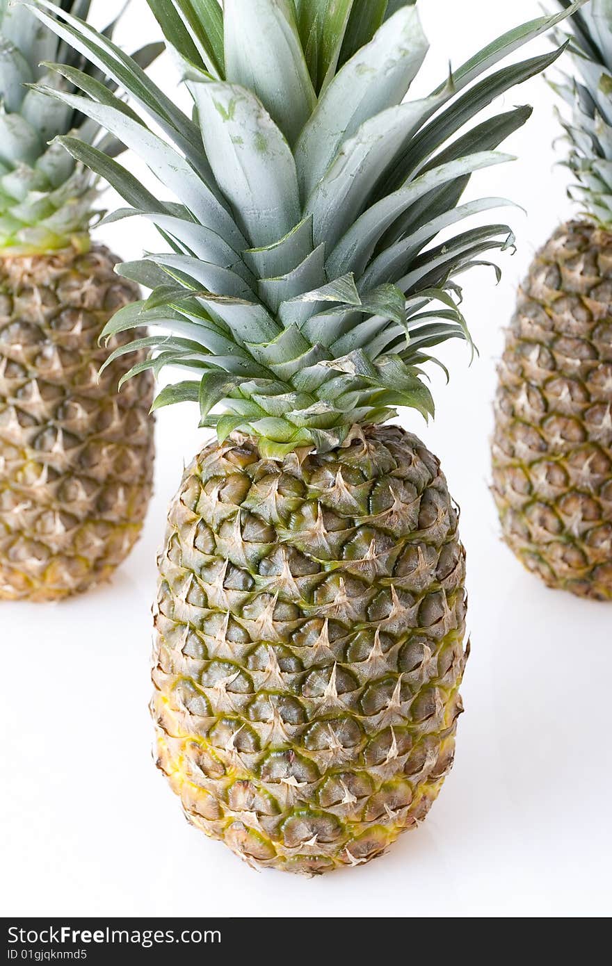 Big pineapples on white background